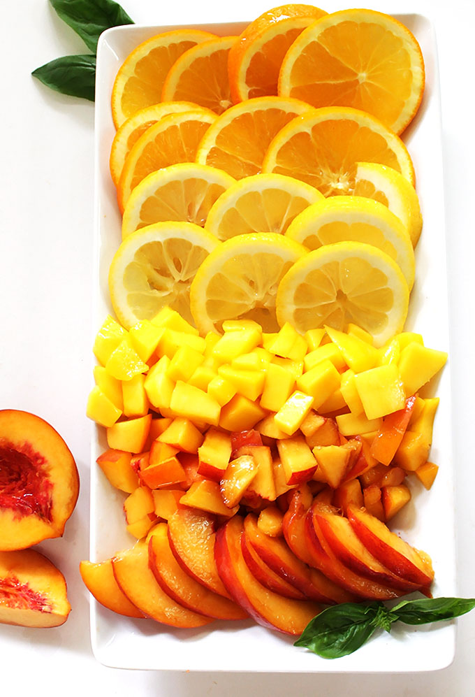 Peach Mango Sangria. Filled to the brim with peaches and mango. Fruity and refreshing. #sangria #summercocktail #refinedsugarfree | robustrecipes.com