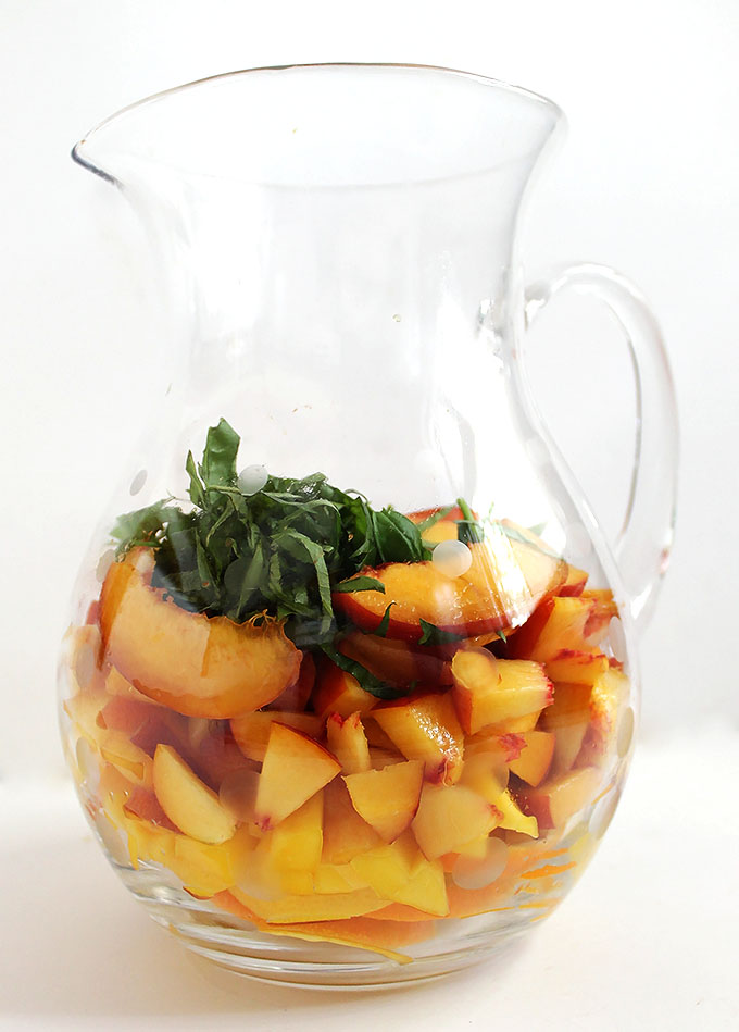 Peach Mango Sangria. Peach-y, mango-y, refreshing. #sangria #summercocktail #refinedsugarfree | robustrecipes.com