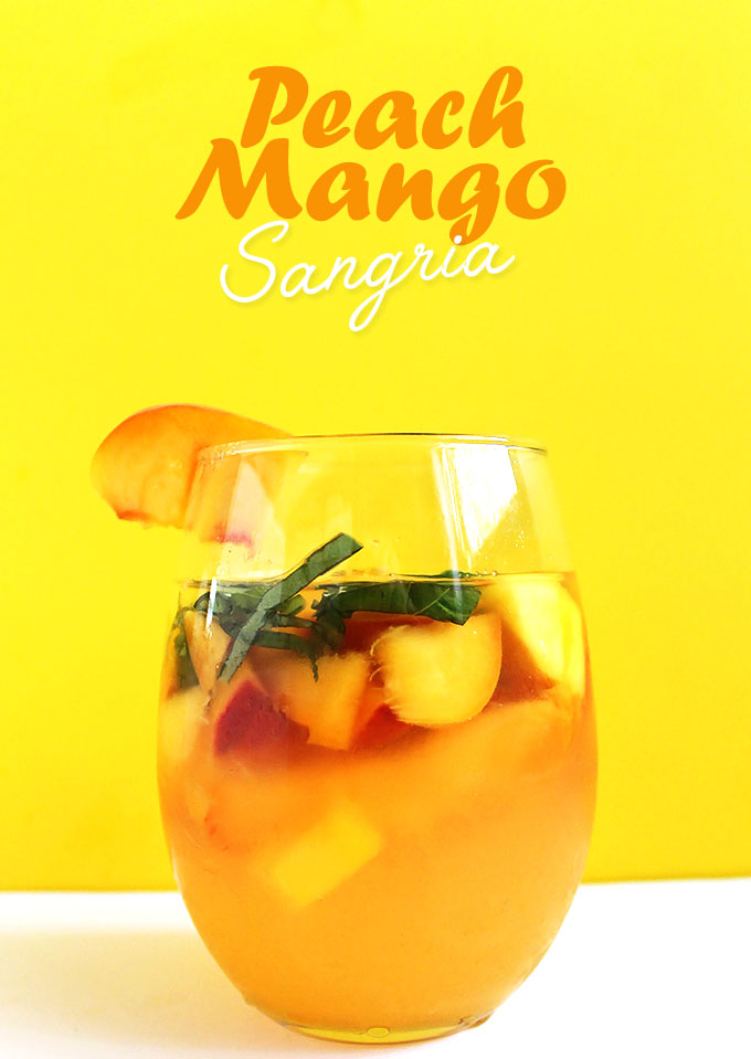 Peach Mango Sangria. Super Refreshing. Easy to make. Bursting with fruity flavor! Perfect for a hot summer evening. #sangria #summercocktail #refinedsugarfree | robustrecipes.com