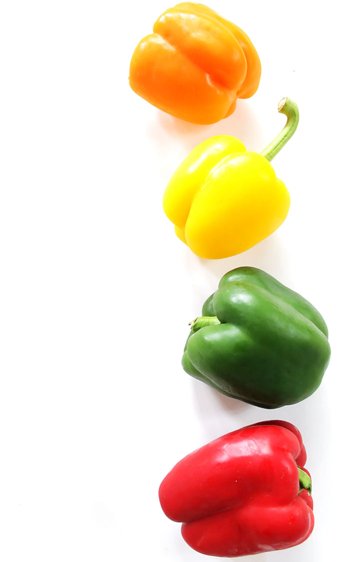 Colorful bell peppers for Greek Quinoa Stuffed Peppers. #glutenfree #recipe | robustrecipes.com