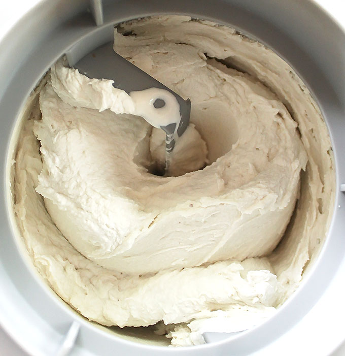 Raspberry swirl chocolate chip ice cream churning away in the ice cream maker. #vegan #glutenfree #refinedsugarfree #icecream | robustrecipes.com