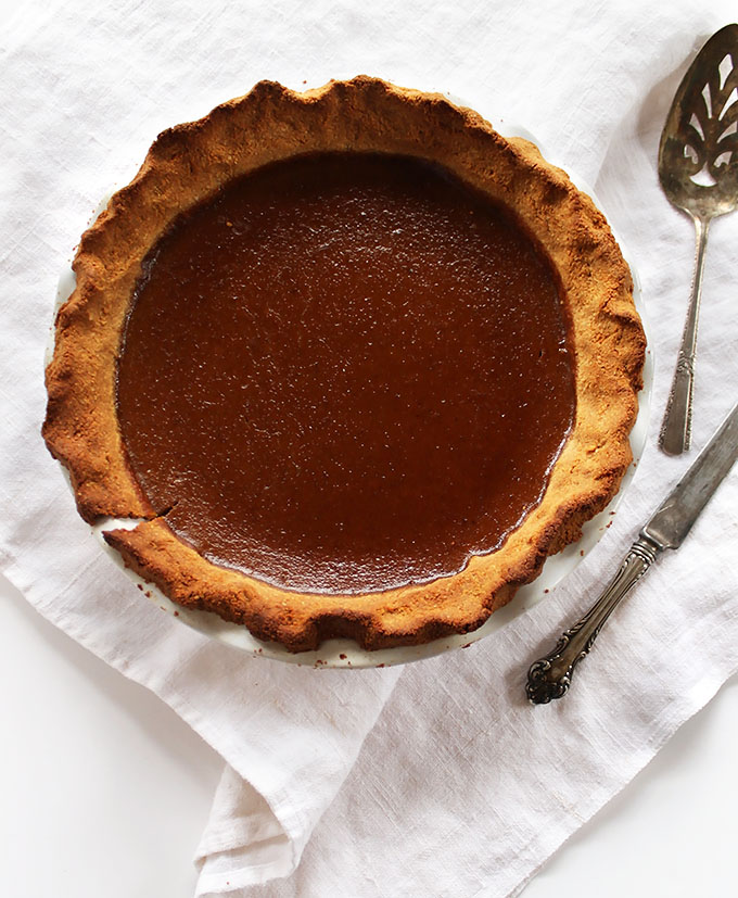 Gluten Free Pumpkin pie. Hearty crust made from COCONUT flakes with a creamy, perfectly spiced pumpkin custard center!
