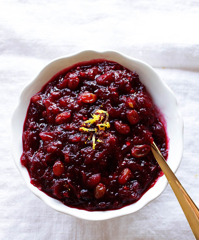 SLow Cooker Sweet and Spicy Cranberry Sauce. So east to make, simple, tart, and slightly spicy. Perfect for Thanksgiving!