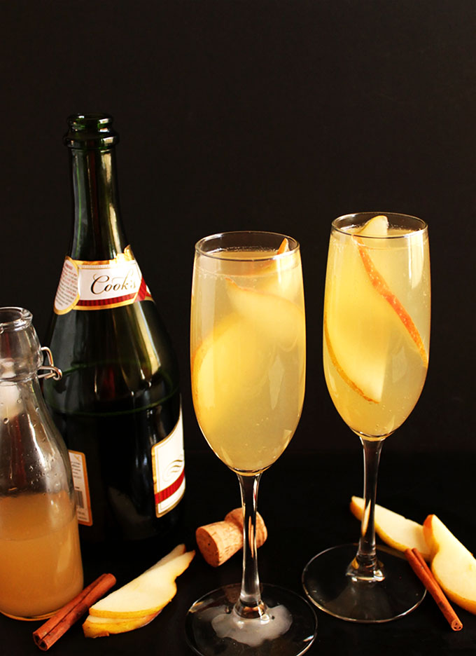 Pear Mimosa. So easy to make. Sweet pear with a hint of warming cinnamon, mixed with bubbly champagne! Perfect for any cocktail celebration party!