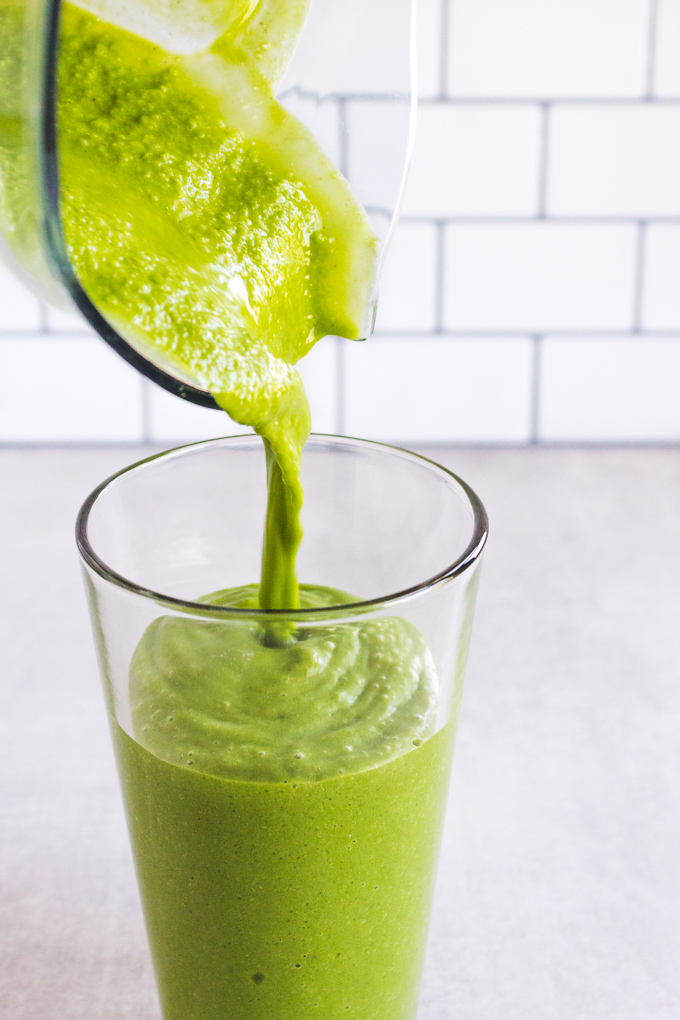 This shamrock shake recipe is a healthier twist on the traditional mint flavored milkshake enjoyed during St. Patrick's Day. It's an indulgent green smoothie that's naturally sweetened, and colored with spinach that you can't taste. It will satisfy the most intense minty milkshake craving. #greensmoothierecipe #healthydessert #stpatricksday #stpatricksdayrecipe #spinach #shamrockshakerecipe #shamrockshake #peppermint #glutenfreerecipe | robustrecipes.com
