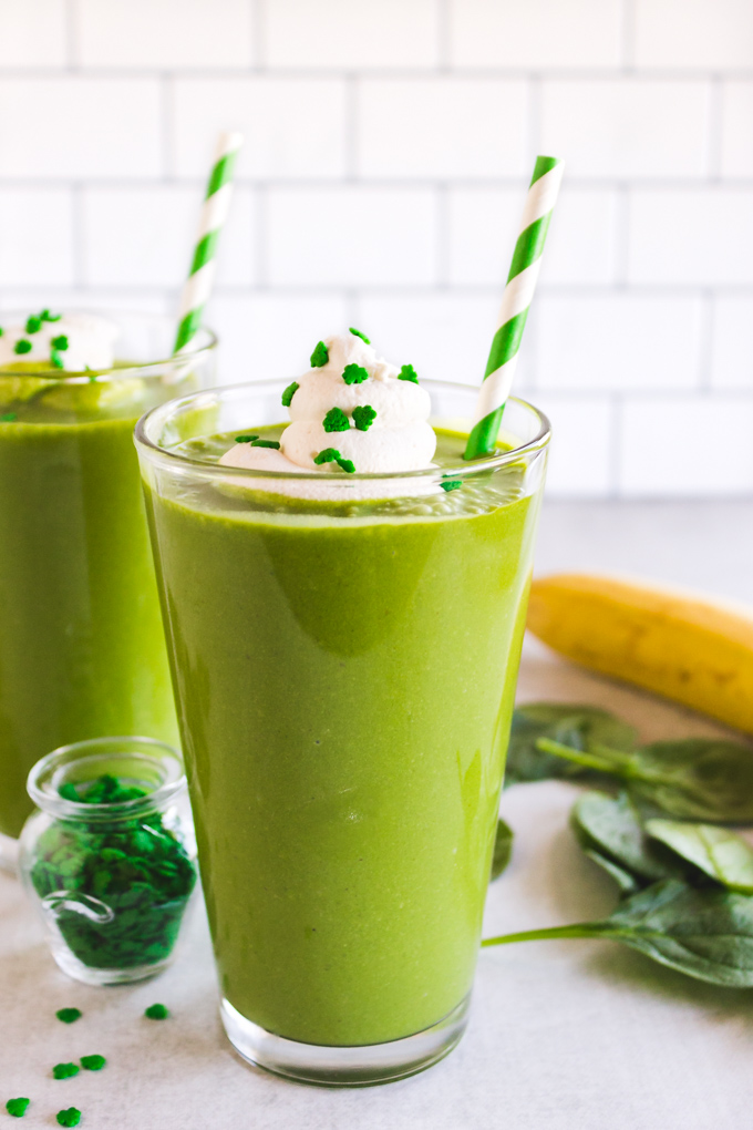 This shamrock shake recipe is a healthier twist on the traditional mint flavored milkshake enjoyed during St. Patrick's Day. It's an indulgent green smoothie that's naturally sweetened, and colored with spinach that you can't taste. It will satisfy the most intense minty milkshake craving. #greensmoothierecipe #healthydessert #stpatricksday #stpatricksdayrecipe #spinach #shamrockshakerecipe #shamrockshake #peppermint #glutenfreerecipe | robustrecipes.com