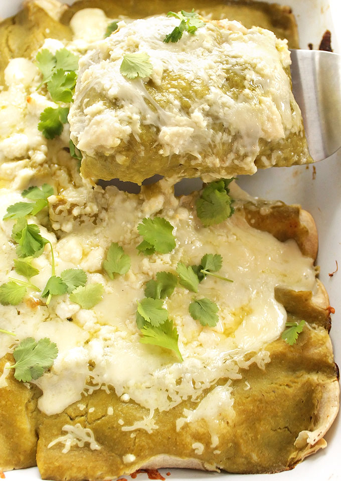 Easy Green Chicken Enchiladas - BEST ENCHILADAS! Stuffed with cheese and shredded chicken. Topped with roasted green enchilada sauce! Perfect for a weeknight meal! Gluten Free | robustrecipes.com