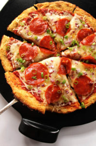 Easy Cauliflower Pizza Crust - A HEALTHY, delicious, pizza crust that won't fall apart. You can top the pizza with anything you prefer. Gluten Free. |robustrecipes.com