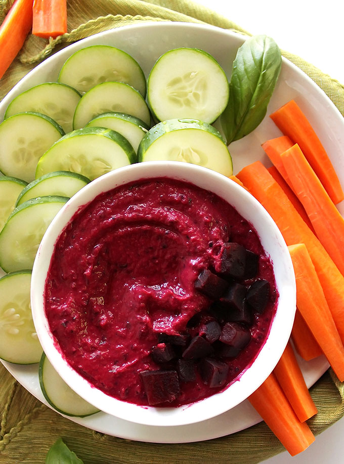 Beet Basil Hummus - A twist on traditional hummus. It's loaded with sweet beets and fresh basil. It's an EASY recipe to make, healthy, and perfect for summer parties! Vegetarian/Gluten Free