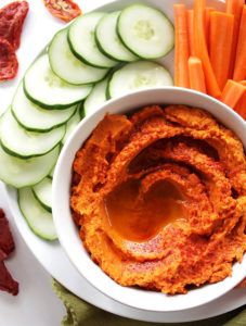 Smoky Sun Dried Tomato Hummus - Rich, creamy hummus packed with a bold smoky flavor and sweet sun dried tomatoes! This recipe is EASY to make, is healthy and great as a snack, side, or appetizer! So yum! Vegan & Gluten Free.