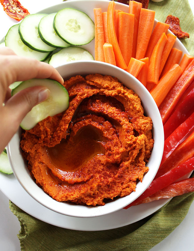 Smoky Sun Dried Tomato Hummus - Rich, creamy hummus that's bursting with sweet sun dried tomatoes and plenty of smoky flavor to keep your taste buds dancing. This recipe is super EASY to make, and is healthy - made with whole food ingredients. So Good! Vegan & gluten free.