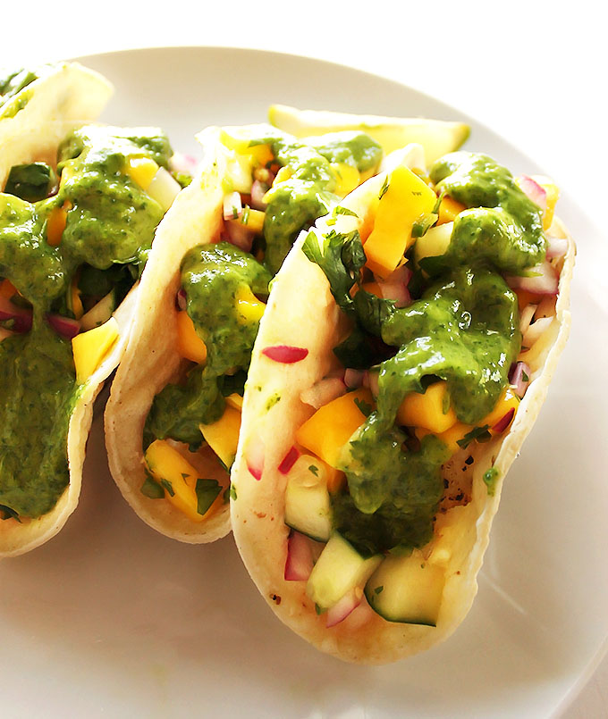 Fish Tacos with Cucumber Mango Pico De Gallo and Cilantro Sauce - Easy, healthy, summertime recipe that comes together in 20 minutes! Gluten free