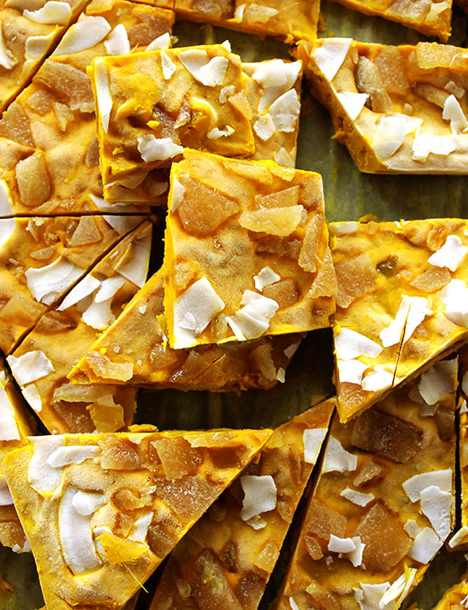 Golden Milk Frozen Yogurt Bark - Inspired by golden milk yogurt bark is packed with healthy turmeric. It's creamy, nutty, with a nice kick from crystallized ginger! This recipe is quick and EASY to make. Perfect for a summer snack! Gluten Free