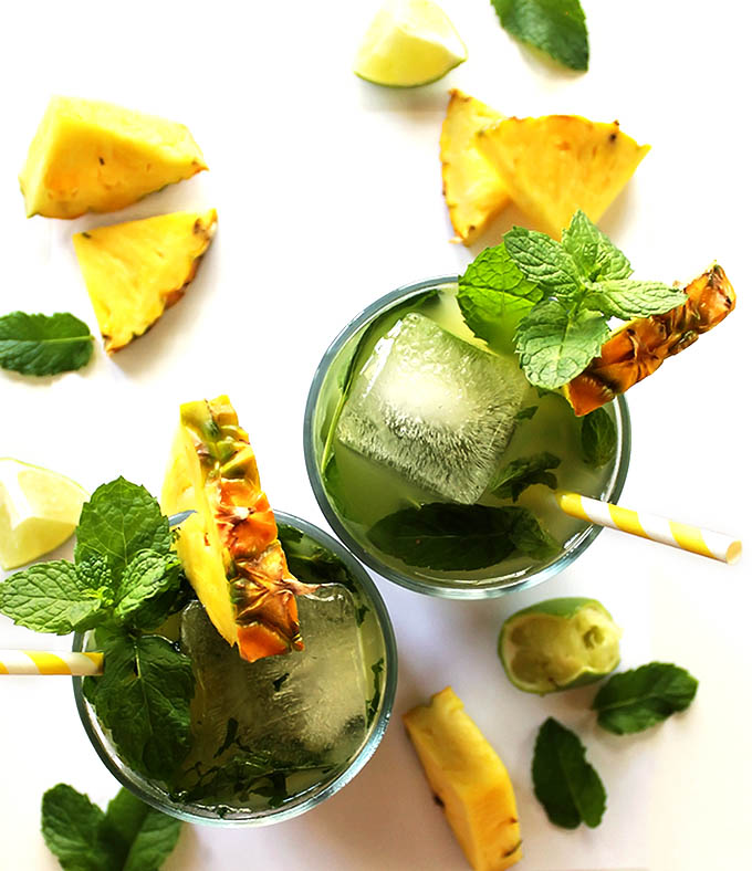 Pineapple Mojitos - Slightly sweet, heavy on the mint, with a touch of lime! This recipe is super easy to make and ideal for hot summer nights! refined sugar free/ gluten free.