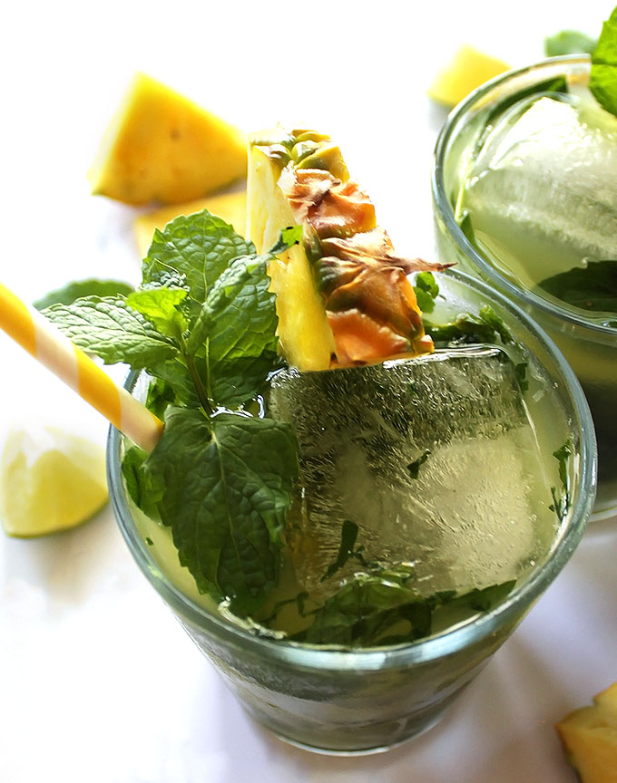 Pineapple Mojitos - Refreshing mojitos that are slightly sweet, heavy on the mint with a hint of lime. This recipe is easy to make and ideal for a hot summer evening. refined sugar free/gluten free.
