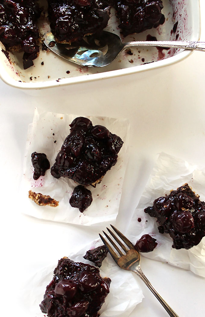 Gluten Free Chocolate cherry Dessert Bars - We LOVE this recipe! A layer of hearty crust, a layer of chocolate, topped with a layer of jam-like cherries. Easy to make, no baking required. Wholesome, real ingredients! Vegan/ refined sugar free/ gluten free