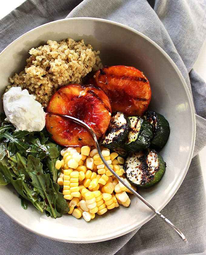 Grilled Peach and Zucchini Summer Bowls - Packed with fresh summertime ingredients: grilled peaches, fresh sweet corn, grilled zucchini, arugula, quinoa, and goat cheese! The perfect end of summer recipe! Vegetarian/gluten free