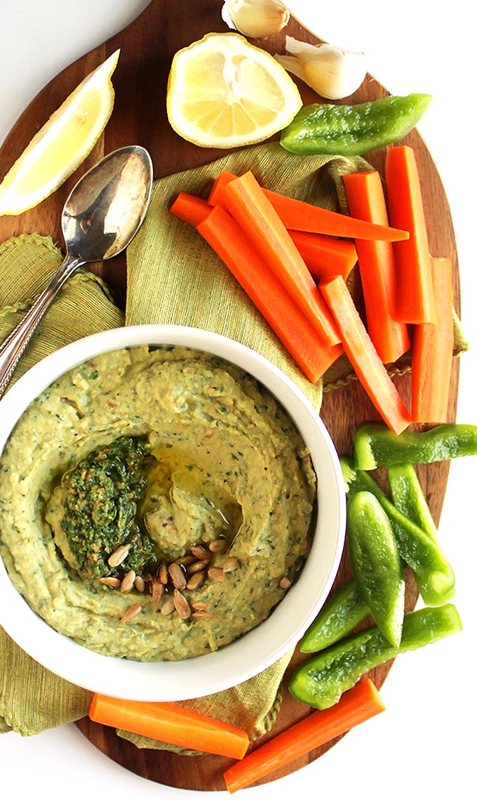 Pesto Hummus - Creamy hummus combined with fresh, zesty basil. This recipe is EASY to make and healthy to eat! Serve with veggies or crackers! Vegetarian/ Gluten Free.