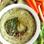 Pesto Hummus - Smooth, rich hummus mixed with fresh garlicky basil pesto! This recipe is EASY to make and healthy! Serve with veggies or crackers! Gluten free/vegetarian.