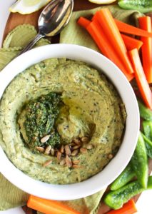 Pesto Hummus - Smooth, rich hummus mixed with fresh garlicky basil pesto! This recipe is EASY to make and healthy! Serve with veggies or crackers! Gluten free/vegetarian.