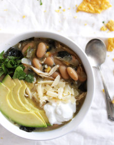 Slow Cooker White Chicken Chili - Warming and comforting. This recipe is EASY to make! It makes a huge batch and freezes well! We LOVE this chili on cold days! gluten free/dairy free | robustrecipes.com