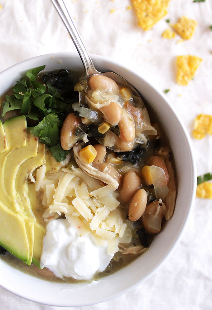 Slow Cooker White Chicken Chili - Comforting and warming. This recipe is super EASY to make thanks to the slow cooker! It makes a huge batch and freezes well! Perfect meal for cold evenings! Dairy free/gluten free | robustrecipes.com