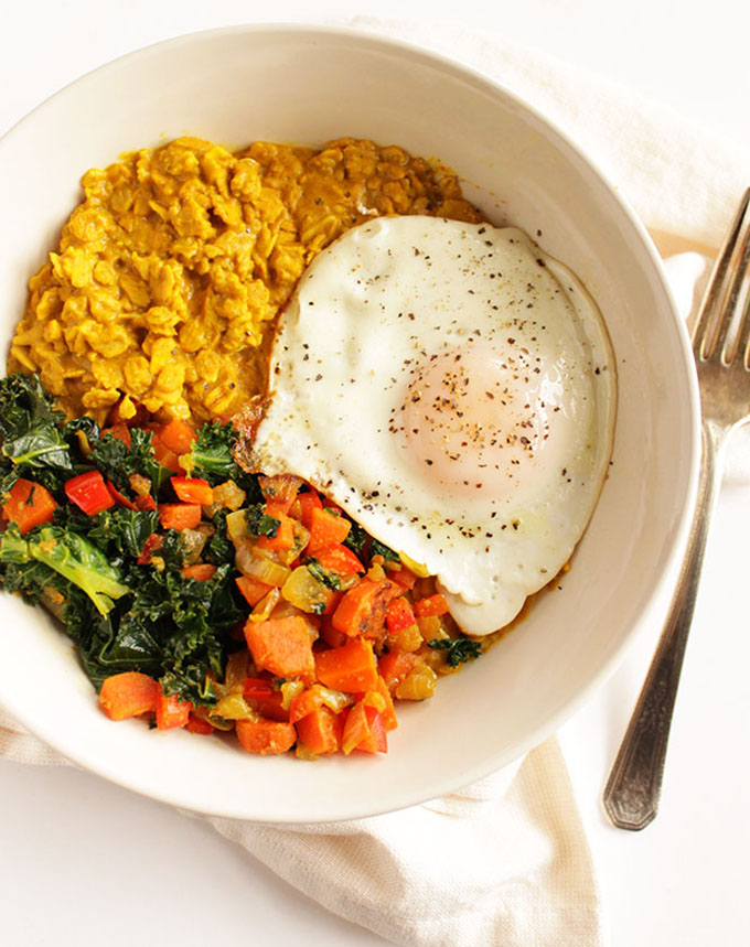 Savory Curried Oatmeal with Veggies and Fried Egg - Creamy curried oatmeal topped with sauteed veggies and a fried egg (or two). A satisfying, balanced breakfast that will keep your full for hours! This recipe includes steps to make a portion of it ahead so that you can enjoy during your busy weekday mornings. Gluten Free/Dairy Free | robustrecipes.com