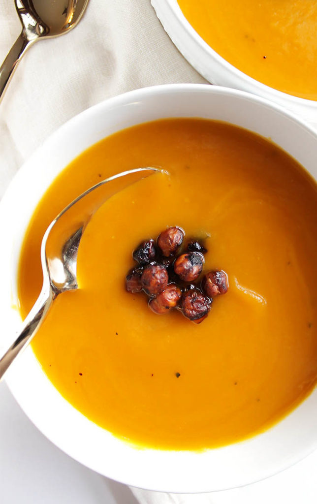 Slow Cooker Butternut Squash Soup - Smooth, creamy, super flavorful and topped with crispy chickpeas. This recipe is perfect for meal prep and freezes well. We LOVE this soup in the winter and fall. Vegan/Gluten Free | robustrecipes.com
