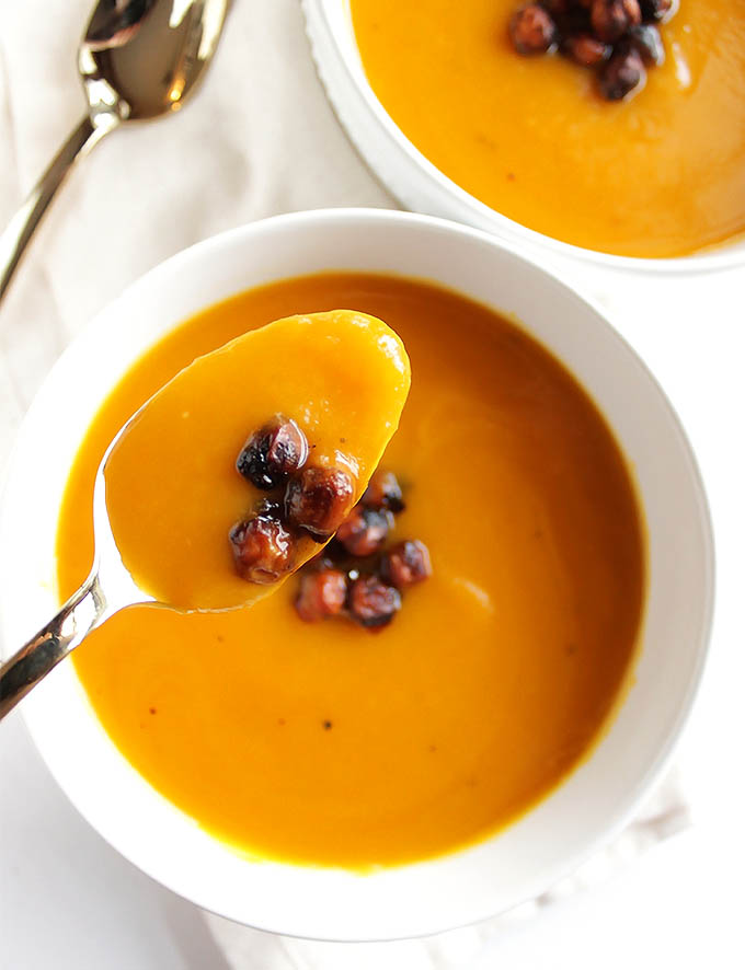 Slow Cooker Butternut Squash Soup - Smooth and creamy this soup is simple yet flavorful. It's topped with crispy chickpeas! This recipe makes a large batch, perfect for meal prep and freezes well. We LOVE this soup in the fall and winter! Vegan/Gluten Free | robustrecipes.com
