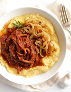 Slow Cooker Shredded Beef Sauce with Creamy Polenta - This recipe is perfect for feeding a large crowd or for meal prep. It also freezes really well! A luscious sauce served over creamy polenta with goat cheese! Gluten Free | robustrecipes.com