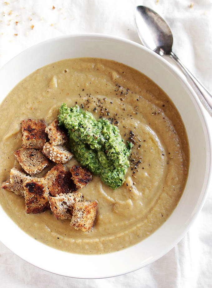Roasted Cauliflower Soup with Arugula Pesto - AND gluten free skillet croutons! Creamy, comforting, flavorful, and nutritious. This recipe is EASY to make. Perfect for winter! Vegan/Gluten Free/Dairy Free | robustrecipes.com
