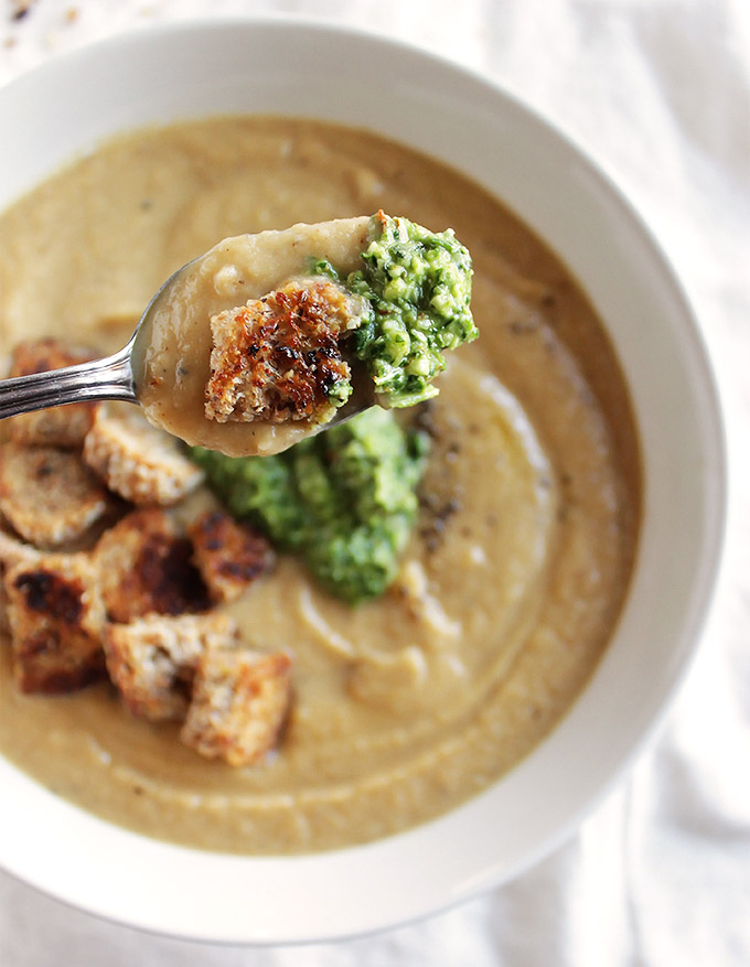 Roasted Cauliflower Soup with Arugula Pesto PLUS gluten free skillet croutons! This soup is packed with veggies, comforting, and super creamy! The perfect recipe for winter! Vegan/Gluten Free/Dairy Free | robustrecipes.com