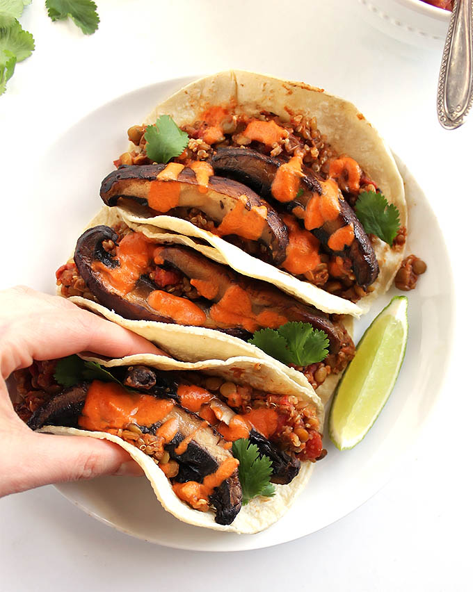 Lentil Mushroom Tacos with Creamy Chipotle Sauce - Filling, satisfying vegan tacos. Packed with 10 grams protein, and 6 grams of fiber per serving. This recipe only takes 40 minutes to make and makes a large batch! Perfect for we weeknight meal! Vegan/Vegetarian/Dairy Free/Gluten Free | robustrecipes.com