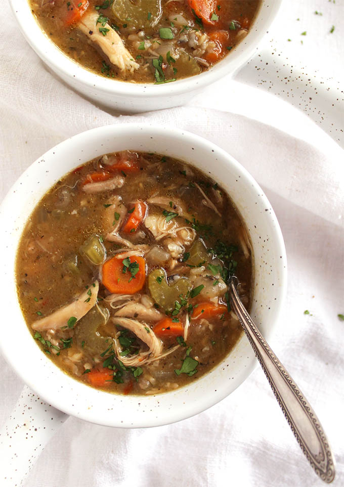 Slow Cooker Chicken and Wild Rice Soup - This soup is perfect for when your are sick or feeling under the weather. Only takes 10 minutes to prep and requires 8 simple ingredients! Nutritious, comforting, and delicious! This recipe is also great for meal prepping and/or freezing. Gluten Free/Dairy Free | robustrecipes.com
