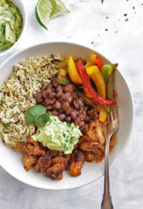 Chicken Fajita Bowls with Cilantro Lime Rice - Bowls with all of the BEST fajita fixings: chicken, black beans, sauteed peppers and onions, guacamole and cilantro lime rice! This recipe is healthy and packed with flavor! Gluten Free/Dairy Free | robustrecipes.com