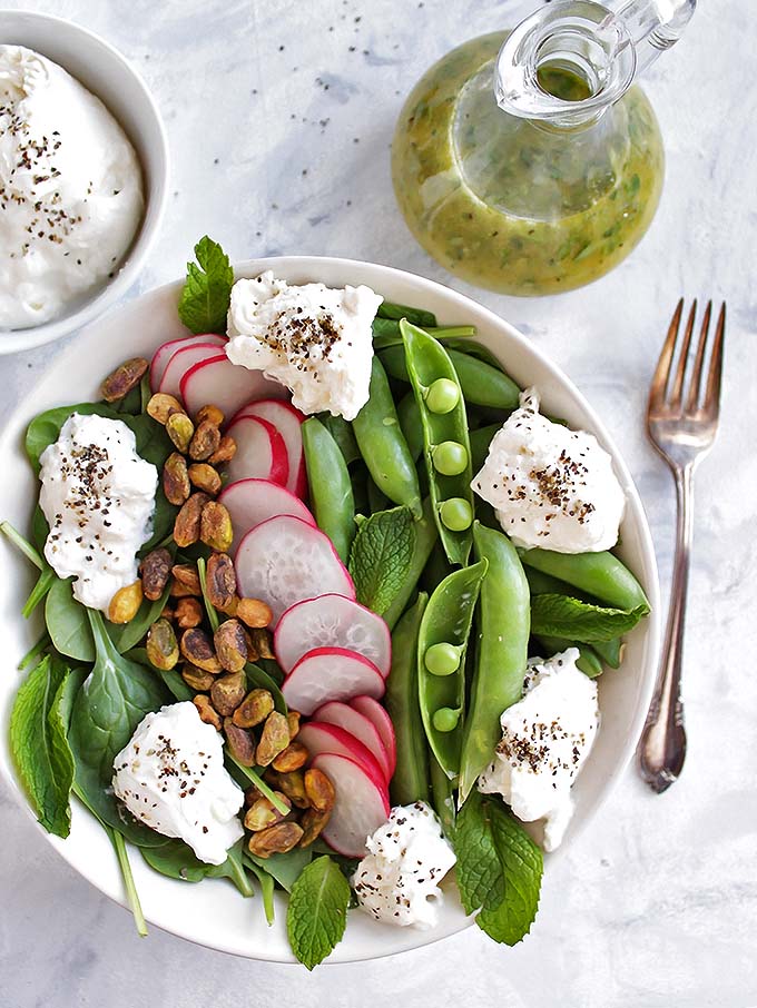 Simple Spring Salad with Sugar Snap Peas and Burrata - only takes 10 minutes to make! Fresh veggies drizzled with a lemon herb vinaigrette! Perfect recipe for a side or appetizer to any meal! Vegetarian/Gluten Free | robustrecipes.com