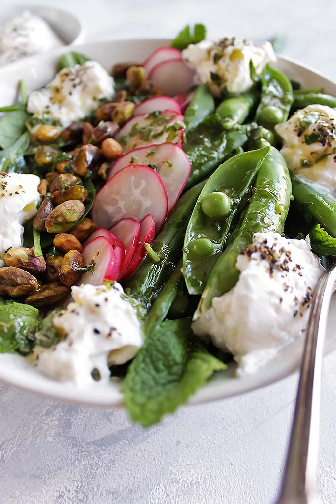 Simple Spring Salad with Sugar Snap Peas and Burrata - a refershing salad loaded with veggies and drizzled with a lemon herb vinagrette! Perfect recipe for a side salad! Gluten Free/Vegetarian | robustrecipes.com