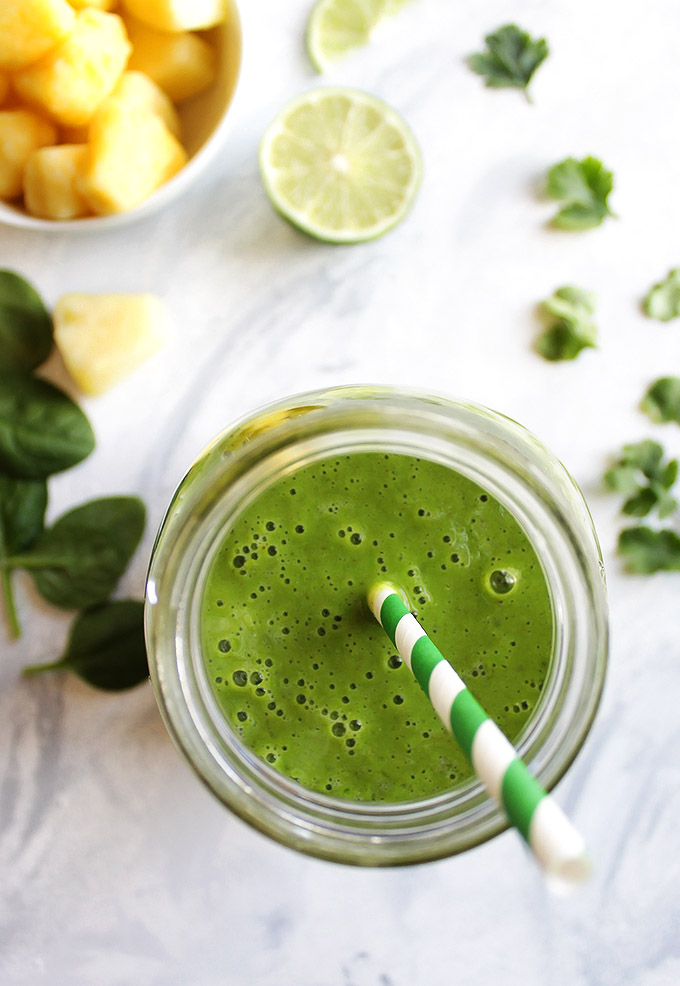 Super Green Pineapple Lime cilantro Smoothie - Sweet, tangy, and refreshing. This smoothie is super healthy, packed with nutritious ingredients: spinach, cilantro, lime, bananas, ginger, matcha tea, cilantro, and pineapple! This smoothie recipe is one of our favorites!!! Vegan/Gluten Free/Refined Sugar Free/Dairy Free | robustrecipes.com