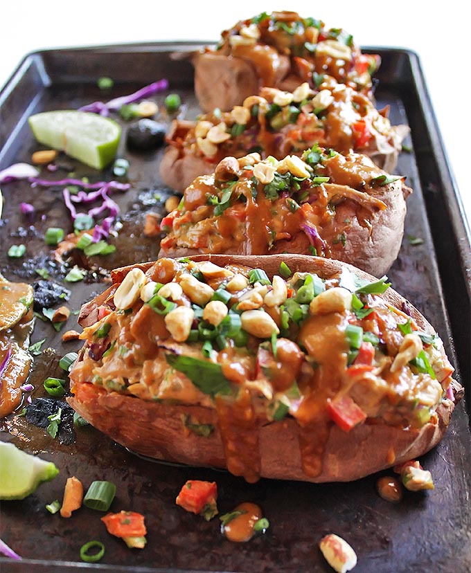 Thai Chicken Stuffed Sweet Potatoes with Peanut Sauce - Baked sweet potatoes that are loaded with chicken and veggies and topped with a tangy, sweet, salty peanut sauce! This recipe is satisfying, comforting, and healthy! Gluten Free/Refined Sugar Free/Soy Free | robustrecipes.com