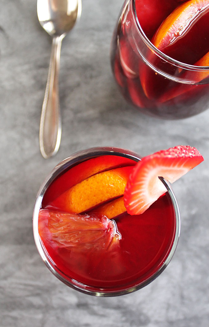 Hibiscus Red wine Sangria - A fruity sangria with a hint of floral tartness from hibiscus tea. This recipe is great for spring and summertime parties. It's refreshing and festive. Gluten Free/Vegan | robustrecipes.com