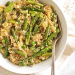 Brown Rice Spring Risotto - Risotto made with brown rice for added health benefits and more texture. This risotto is packed with spring veggies like leeks, asparagus, and peas! This recipe makes a great side dish or add shrimp for a complete meal! Vegetarian/Gluten Free | robustrecipes.com