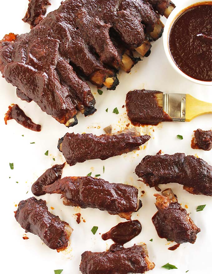 Easiest Ever Smoky Slow Cooker Ribs - These ribs are rubbed with a smoky spice rub and brushed with an easy homemade smoky BBQ sauce, They are cooked in the slow cooker for a super flavorful and super tender ribs that are just as good as when they are made in the oven. Perfect recipe for summer! So Yum! Gluten Free/Dairy Free | robustrecipes.com