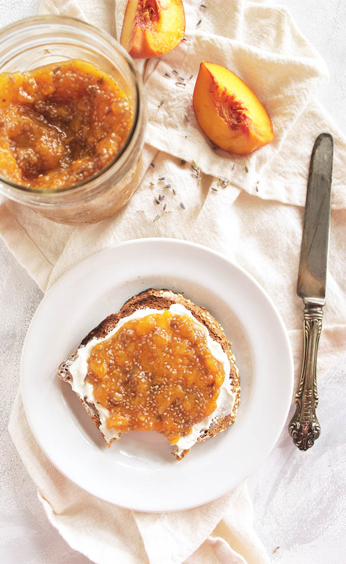5 ingredient peach lavender chia jam - Bursting with fresh peaches and a hint of lavender this jam is great spread onto anything. This recipe only takes 30 minutes to make and uses chia seeds as a thickener instead of pectin or a ton of sugar. Perfect for brunch parties, or would make a great gift. Vegan/gluten free/refined sugar free | robustrecipes.com