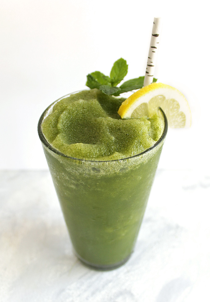 Basil Mint Lemon Slushie - A healthy and super refreshing slushie made using fresh basil, mint, and lemon. Perfect for hot summer days. Makes a delicious healthy dessert. This recipe only requires 10 minutes to make, a handful of ingredients, and a blender! Vegan/Gluten Free/ Refined Sugar free | robustrecipes.com