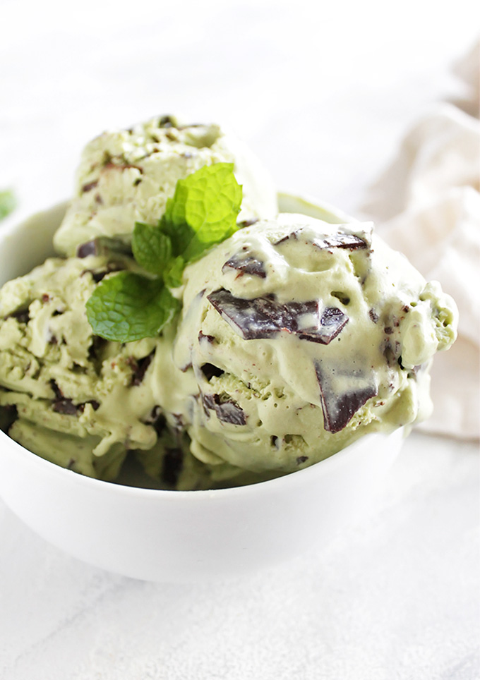 Vegan Mint Chip Ice Cream - Rich creamy and super minty. It's studded with homemade chocolate chunks that melt in your mouth. It's also dyed using an easy homemade all natural food coloring! We LOVE this recipe for a summer time treat! Gluten Free/Dairy Free | robustrecipes.com