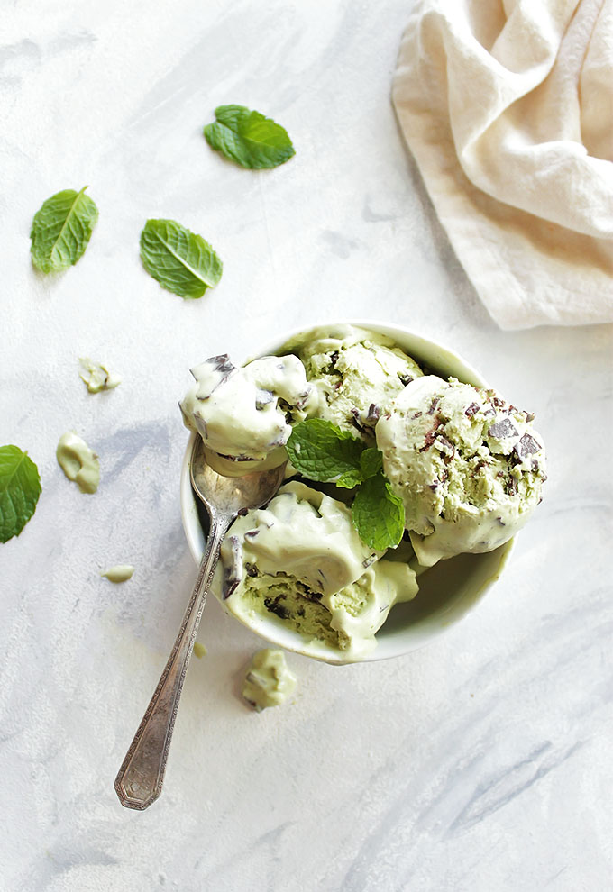 Vegan Mint Chip Ice Cream - Rich creamy and super minty. It's studded with homemade chocolate chunks that melt in your mouth. It's also dyed using an easy homemade all natural food coloring! We LOVE this recipe for a summer time treat! Gluten Free/Dairy Free | robustrecipes.com