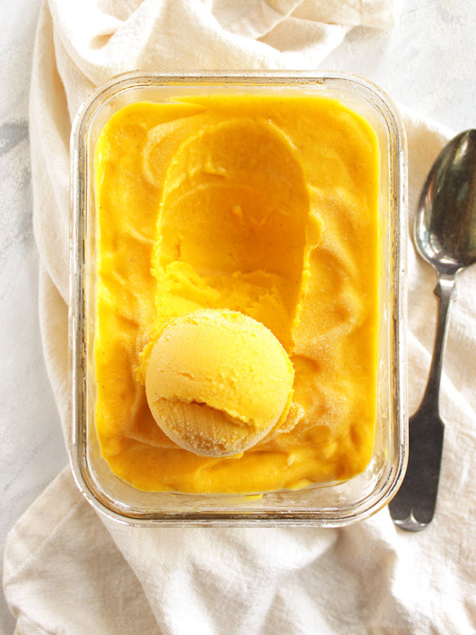 Creamy, sweet and slightly tangy with a hint of cardamom for that classic mango lassi taste. This frozen yogurt recipe is super easy to make, only 15 minutes of hands on time and no ice cream maker required! The perfect summertime treat. Gluten Free/Refined Sugar Free | robustrecipes.com