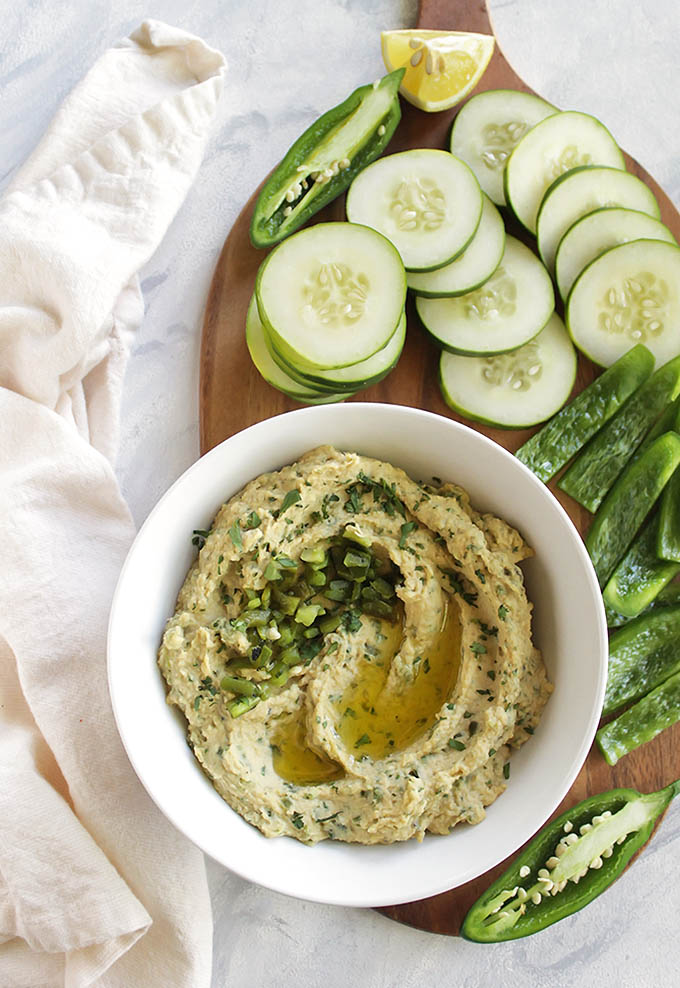 Roasted chili pepper hummus is studded with roasted poblano pepper, roasted jalapeno, and fresh cilantro. Serve it with cucumbers, bell peppers, or chips. Perfect recipe for a side, snack, appetizer and for taking to parties. Gluten Free/Vegan | robustrecipes.com