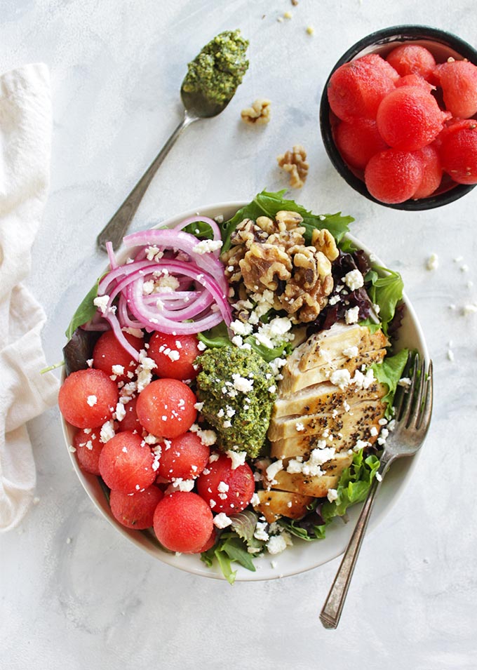 Loaded Watermelon Salad with Pesto - An entree salad loaded with sweet, juicy watermelon, basil pesto, pickled red onions, walnuts, pan seared chicken, feta cheese and a balsamic vinaigrette. It's the perfect balance of sweet and savory. This recipe is perfect for weeknight dinners! (Gluten Free) | robustrecipes,com