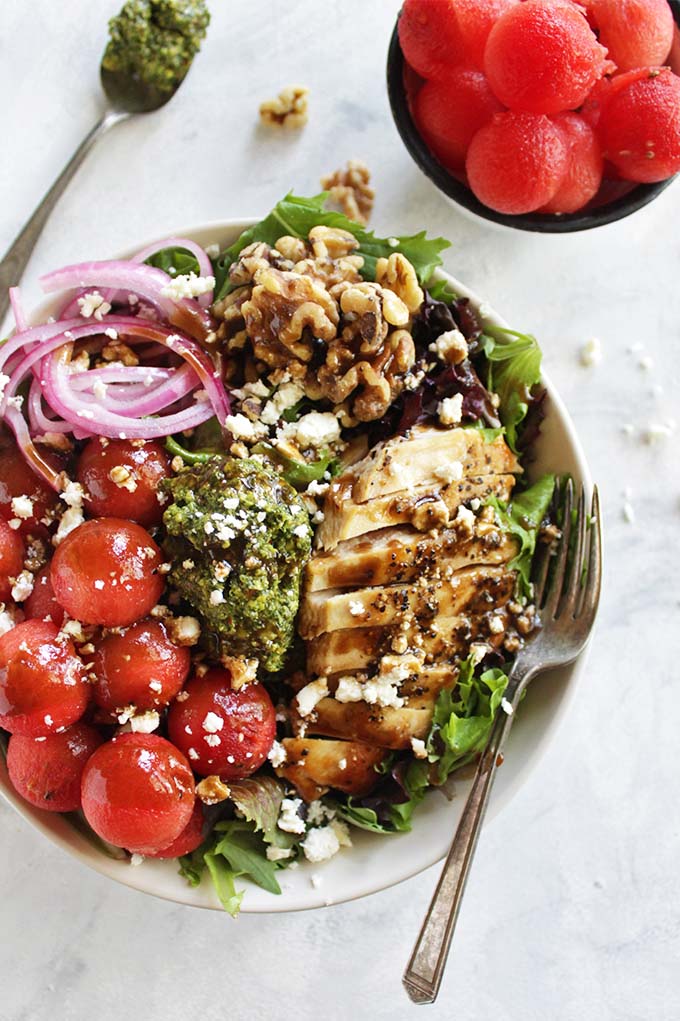 Loaded Watermelon Salad with Pesto - An entree salad loaded with sweet, juicy watermelon, basil pesto, pickled red onions, walnuts, pan seared chicken, feta cheese and a balsamic vinaigrette. It's the perfect balance of sweet and savory. This recipe is perfect for weeknight dinners! (Gluten Free) | robustrecipes,com